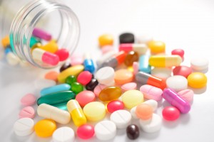 Pills and capsules on white